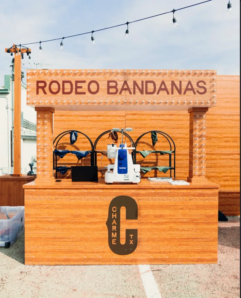 Branded Rodeo Bandanas booth for Charme TX built with wood-look vinyl and cut letters