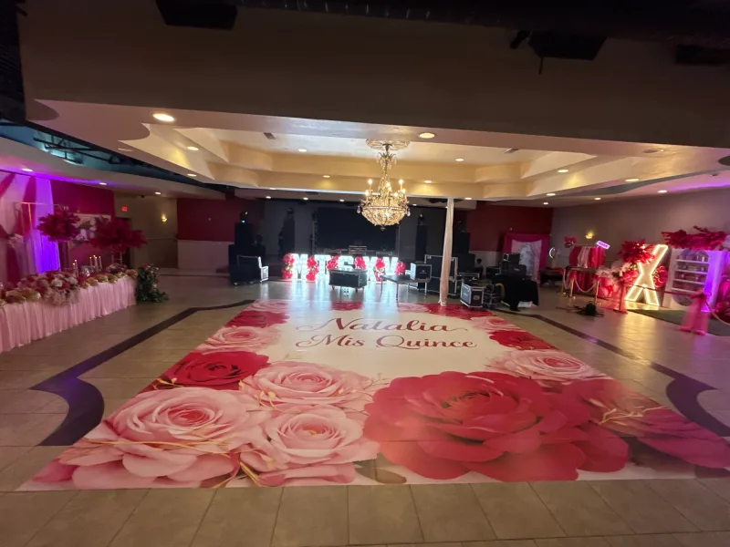 Printed vinyl dance floor wrap with roses and the name Natalia for a quinceanera