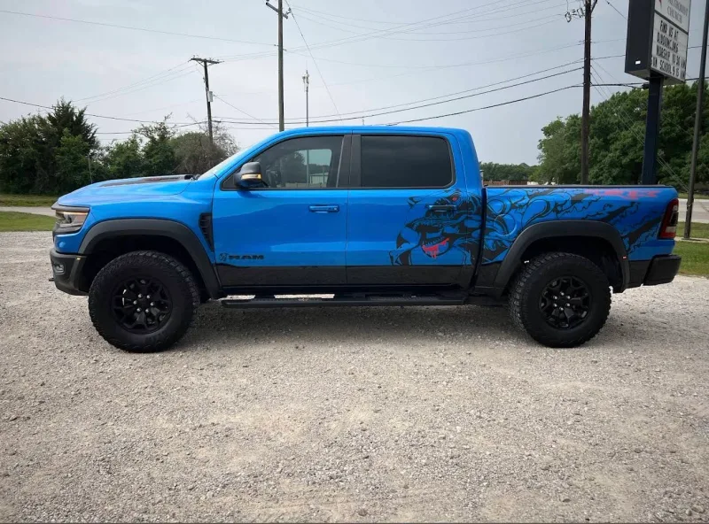 Blue RAM TRX pickup with custom printed vinyl side graphics